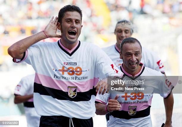 Fabio Grosso of Palermo celebrates scoring during the Seria A match between Roma and Palermo at the Stadio Olimpico on October 24, 2004 in Rome,...