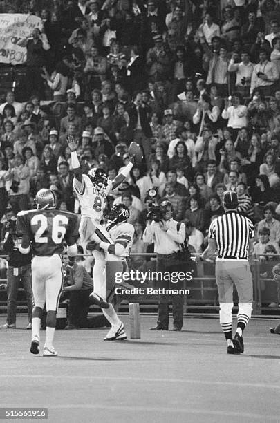 Houston: Oklahoma State University Ernest Anderson holds up teammate Jamie Harris after Harris scored a touchdown against Baylor during the 2nd...