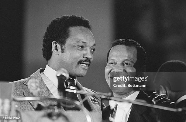 Democratic presidential candidate Jesse Jackson is introduced at the Black Muslim Savior's Day rally 2/25 by Louis Farrakhan, leader of the Nation of...