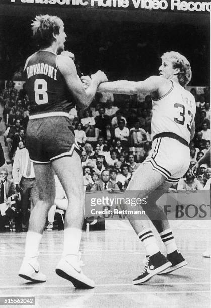 76ers' Marc Iavaroni and Celtics' Larry Bird trade punches during 1st quarter, exhibition game, Boston Garden . Both were ejected from the game.