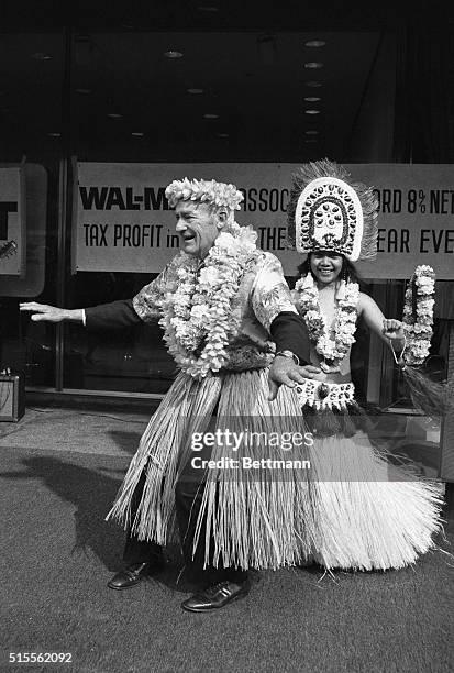 Paying off a bet, Sam Walton, chairman of Wal-Mart Stores, a discount chain, does hula in the Financial District here 3/15. Walton from Bentonville,...