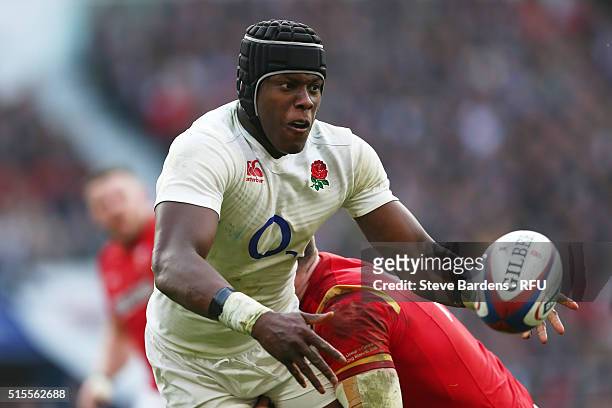 Maro Itoje of England is tackled by Alex Cuthbert of Wales during the RBS Six Nations match between England and Wales at Twickenham Stadium on March...
