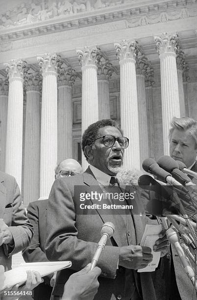 Reverend Joseph Lowery, head of the Southern Christian Leadership Conference, talks to reporters outside the Supreme Court after the Supreme Court...