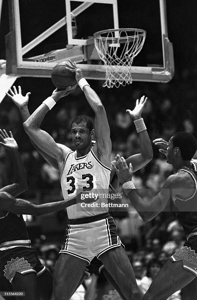 Kareem Abdul-Jabbar Surrounded by Hands