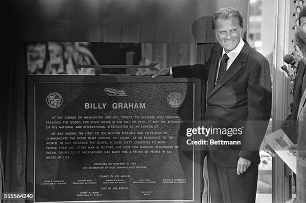 Evangelist Billy Graham unveils the plaque commemorating the site of his first crusade that launched his career. At the ceremonies, he preached part...