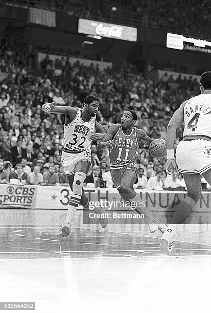 The MVP in the 34 NBA All-Star game, Isiah Thomas of the East, races downcourt besides the West's Magic Johnson as the East beat the West 154 to 145...