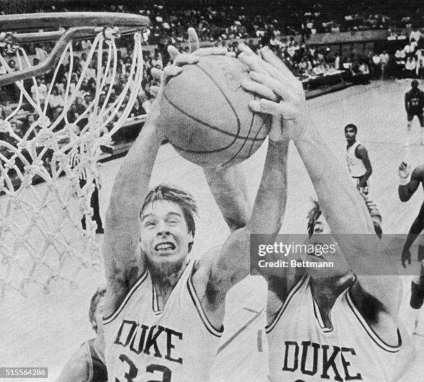 March 17, 1984-Pullman, Washington: Mark Alarie and Jay Bilas fight for the basketball.