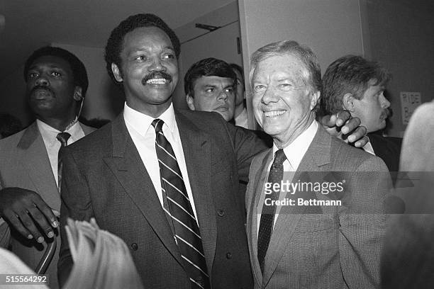 San Francisco, CA- Democratic presidential candidate Rev. Jesse Jackson puts his arm around former President Jimmy Carter during an impromptu visit...