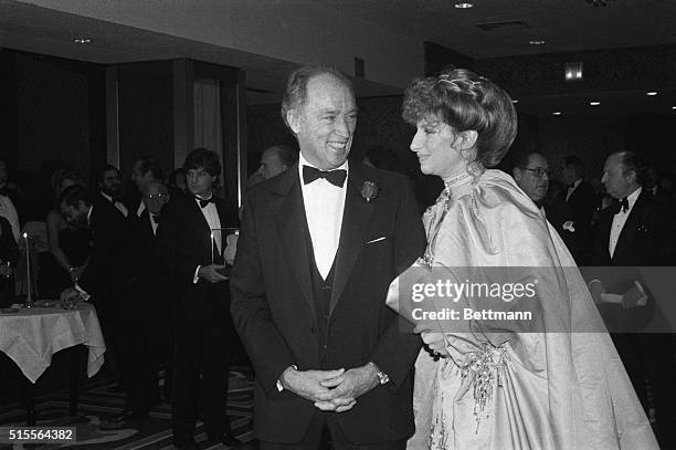 Canadian Prime Minister Pierre Trudeau gives a big smile as he escorts singer Barbara Streisand to a United Jewish Appeal dinner honoring Streisand...