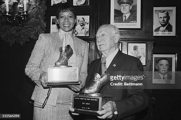 Wilma Rudolph and Abel Kiviat, America's oldest living Olympian, hold their Vitalis Cup awards 12/29 after being named winners for sports excellence....