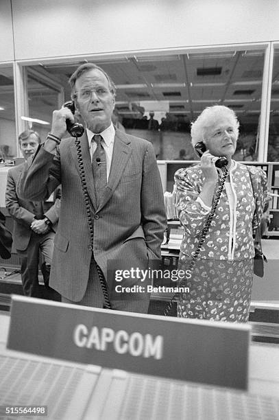 Space Center, Houston: Vice-President George Bush and wife Barbara, talk to the shuttle crew Discovery, from the capcom desk in mission control at...