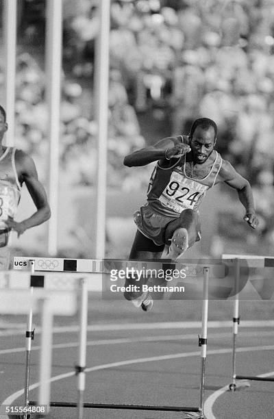 Edwin Moses, American athlete, strides over a hurdle during his gold medal performance in the 400m hurdles at the Olympic Games in Los Angeles.