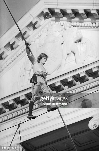Philippe Petit, celebrated French high wire artist, walks the high wire connecting the north and south wings of the Museum of the City of New York....