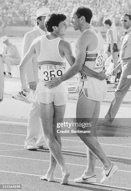 Britain's Steve Ovett, left, is consoled by teammate Sebastian Coe, after Coe won the Silver Medal in the 800m and Ovett finished last in the same...