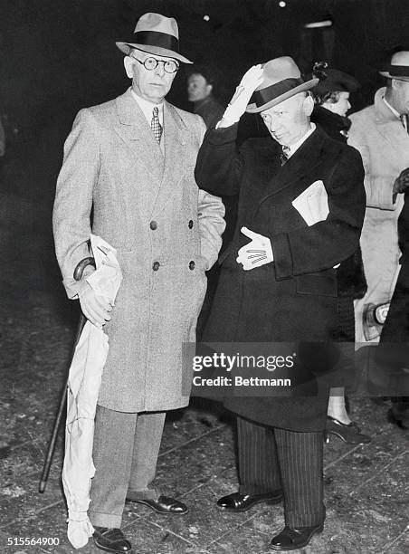 Jesse L. Livermore, left, spectacular Wall Street operator, pictured with a friend, on his arrival in New York, returning from a South American...