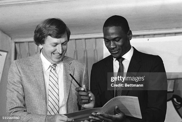 Michael Jordan, former North Carolina star, College Player of the Year and star of the US Olympic gold medal winning team, looks over the...