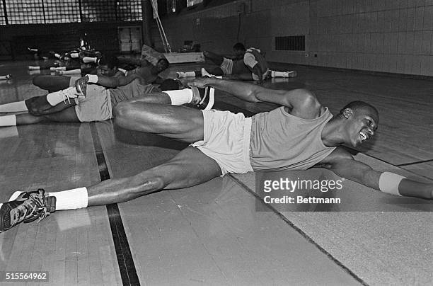 Doing stretching exercises during his first workout with the Chicago Bulls 9/28 is Michael Jordan both 1983 and 1984 College Player of the Year from...