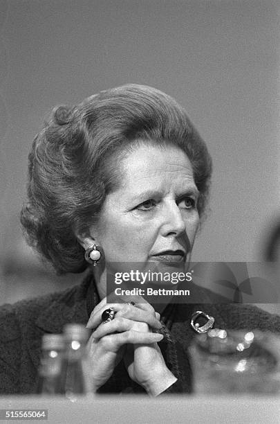 Brighton, England- Britain's Prime Minister, Margaret Thatcher, is pictured listening to the opening day speeches at the Conservative Party...