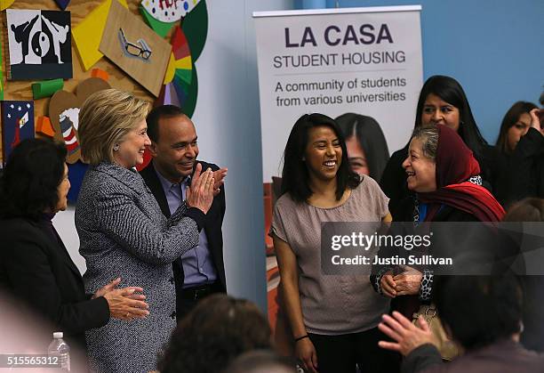 Democratic presidential candidate Hillary Clinton greets residents attending an immigration workshop at the La Casa Resurrection Project on March 14,...