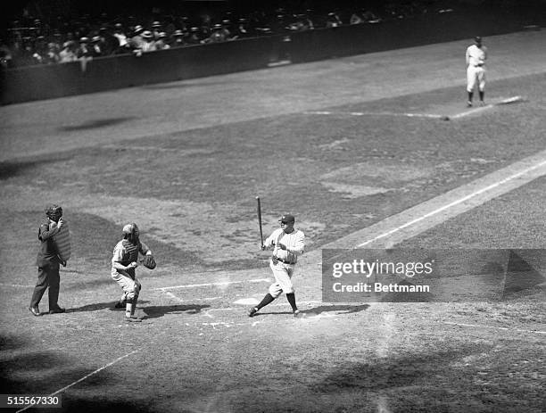 Ruth bats before start of first game...Photo shows Babe Ruth of the New York Yankees as he appeared smacking the pill in batting practice before the...