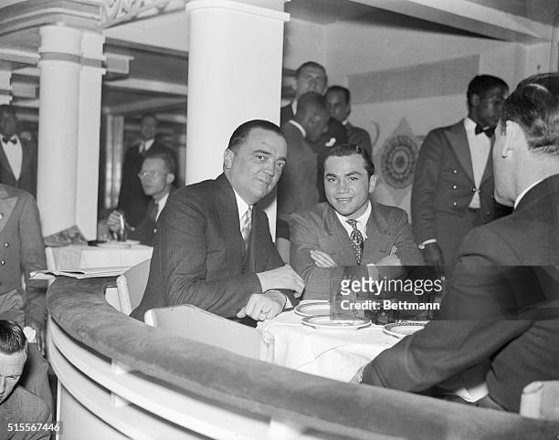 Edgar Hoover, no. 1 defender of the public weal, and Barney Ross, lightweight boxing champion , meet at the Cotton Club, New York night spot. Mr....