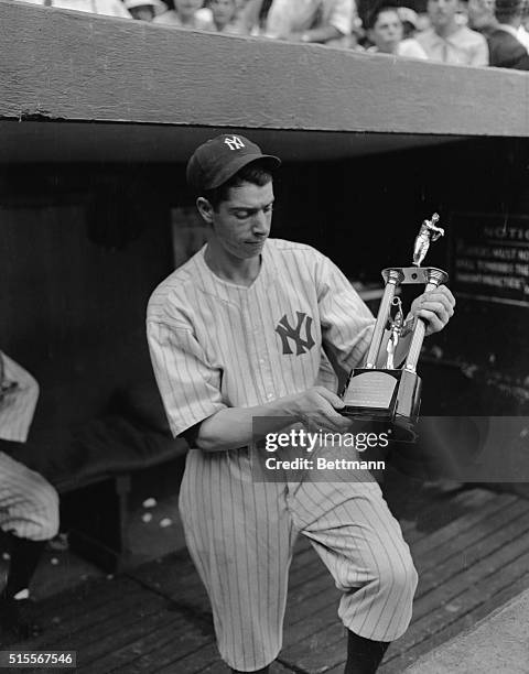 In a ceremony preceding the double header of the Yankees and the St. Louis Browns, in New York City, Joe DiMaggio, the expensive rookie addition to...