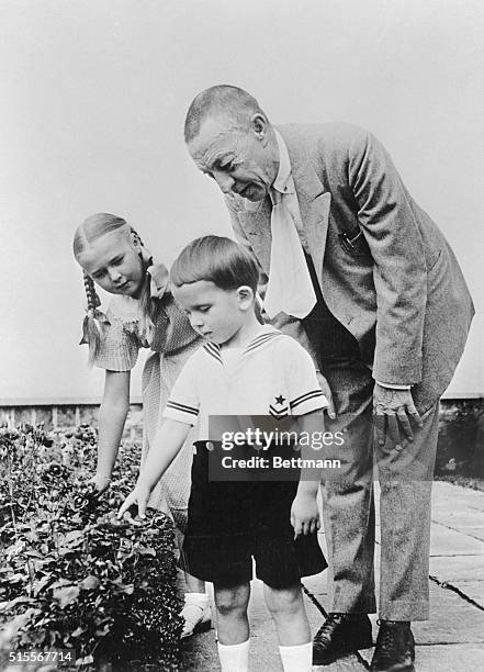 Serge Rachmaninoff is shown with his two grandchildren, Princess Sophie Wolkonsky and Alexander Conus at the Rachmaninoff Estate near Lake Lucerne,...