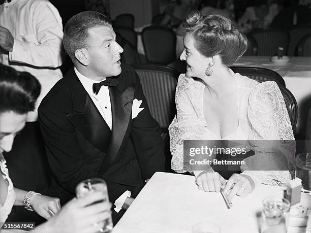 British and RAF War Relief Party given by Mrs. Basil Rathbone is shown with Bette Davis and her husband John Farnsworth attending the event at the...