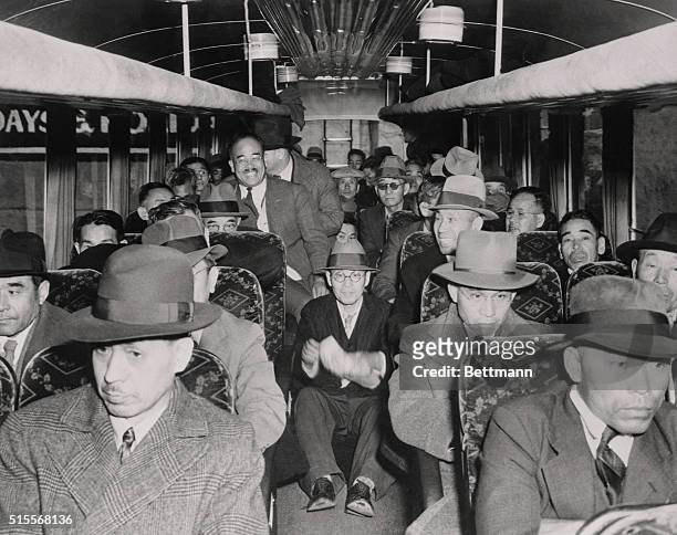 Caught in the city-wide roundup of Japanese aliens, this busload of 39 Japanese, left Los Angeles Hall of Justice under police escort. Their faces...