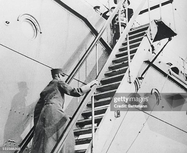 King Haakon VII of Norway boarding the British cruiser which took him from Tromsoe, Norway, to England, where he and his government have continued...