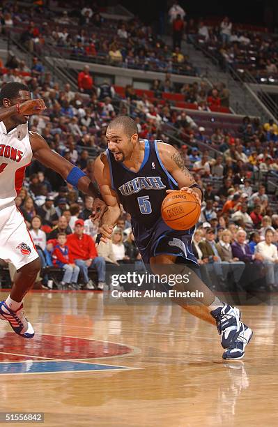 Carlos Boozer of the Utah Jazz drives against Antonio McDyess of the Detroit Pistons during their game on October 24, 2004 at the Palace of Auburn...