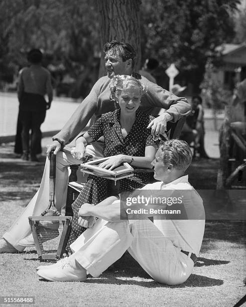 Film notables at Palm Springs...Among the screen notables, at Palm Springs, California, are left to right Edmund Lowe, Lilyan Tashman and Gene...