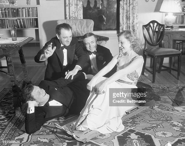 When Film Folk Relax. Hollywood, Calif.: Some of the guests at the party recently given by Harry Lachman, film director. Spencer Tracy is lying on...
