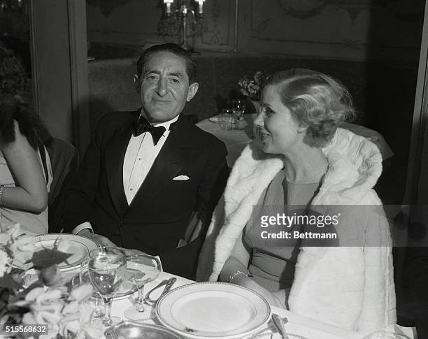 Producer Sam Harris, hosting a dinner party at the Ambassador Hotel, sits with Ruth Marx, wife of Groucho Marx.