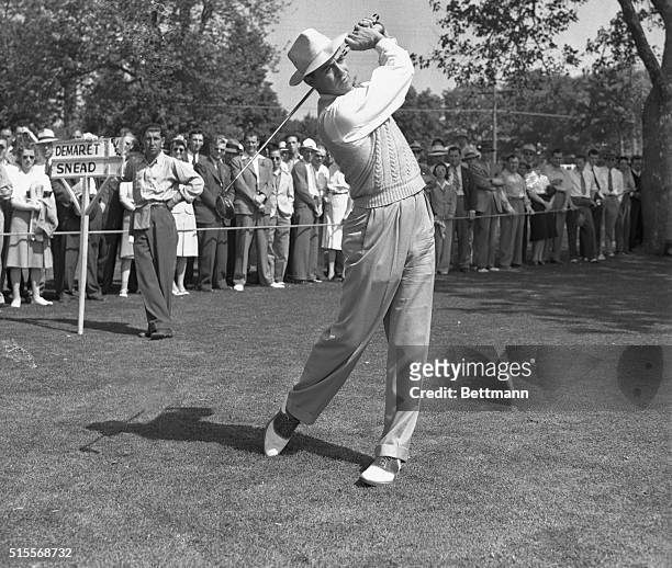 Sammy Snead playing Jim Demaret in the semi-finals of the PGA Championship, drives off the first tee at the start of the first round of their match...