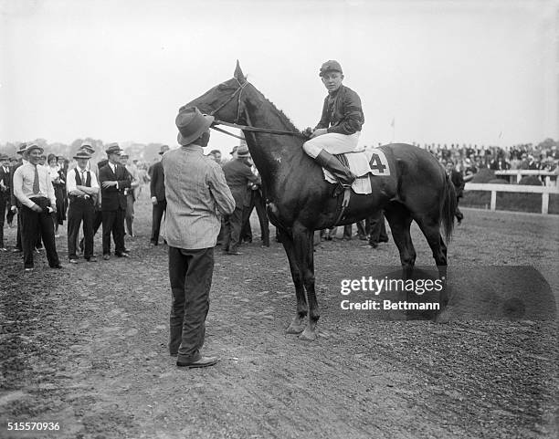 Winner of the Classic and Jockey. Pimlico, Md.: Head Play, owned by Mrs. Silas Mason, is shown with jockey Charley Kurtsinger, after his sensational...