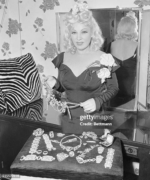 Mae Releases Jewels for Defense. Hollywood, California: Curvaceous Mae West will break up her celebrated collection of diamonds, estimated to be...
