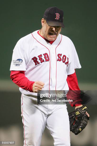 Pitcher Curt Schilling of the Boston Red Sox celebrates a double-play that ended the top of the fifth inning against the St. Louis Cardinals during...