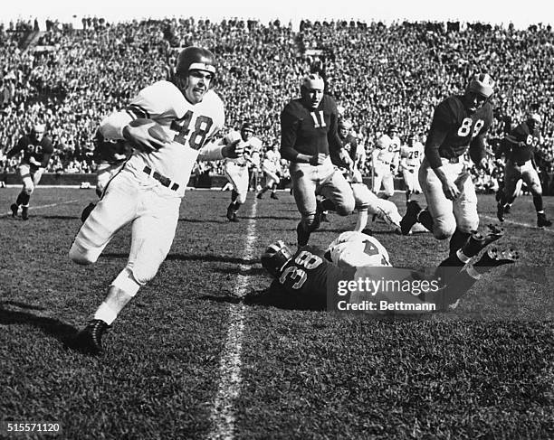 Northwestern's Otto Graham runs for a first down against Michigan at Ann Arbor in the first quarter of Saturday's game. Michigan won, 34-16.