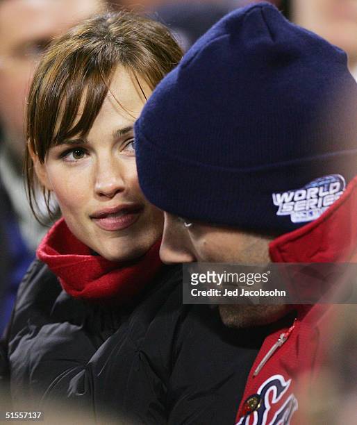 Actors Jennifer Garner and Ben Affleck watch game two of the World Series between the Boston Red Sox and St. Louis Cardinals on October 24, 2004 at...