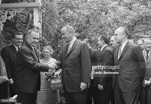 Soviet premier Alexi Kosygin shakes hands with President Johnson, as New Jersey Governor stands watches. | Location: Glassboro State College,...