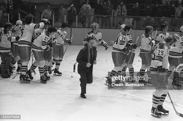 Rangers coach Emile Francis runs onto the ice to congratulate his players after they defeated the Black Hawks to sweep their four game Stanley Cup.