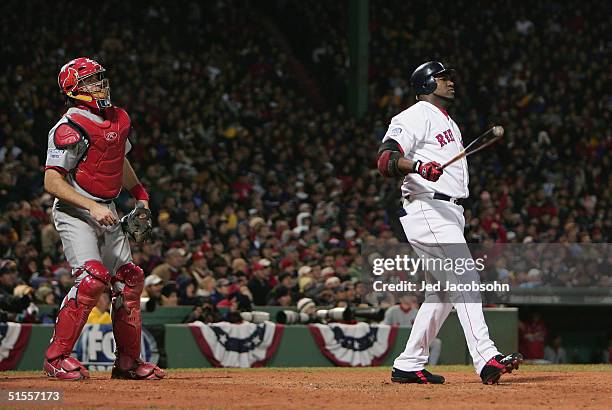 David Ortiz of the Boston Red Sox and catcher Mike Matheny of the St. Louis Cardinals both watch as a ball hit by Ortiz travels just foul of a home...