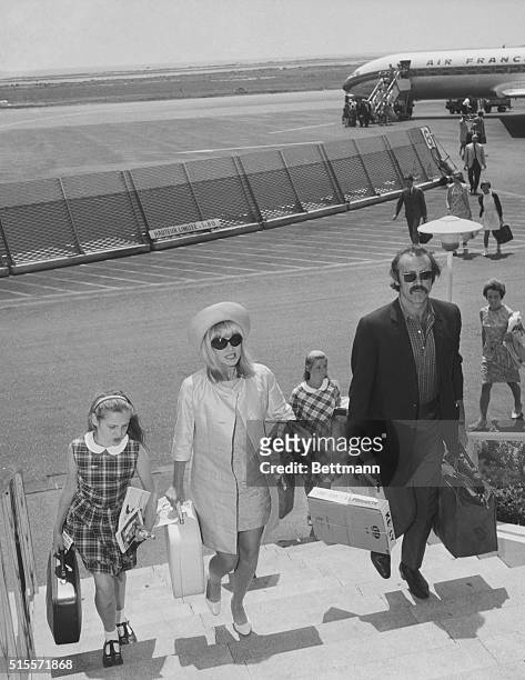 Nice, French Riviera: Wearing a proud moustache, actor Sean Connery arrives at Nice Airport with his wife, Diane Cilento and their daughter, Johana...