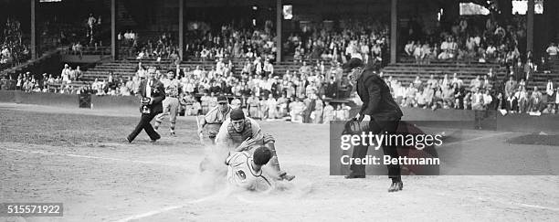 Philadelphia: Scoring Winning Run For Cards. Enos Slaughter, , St. Louis outfielder, crashes the ball out of the hands of Philadelphia catcher Tom...