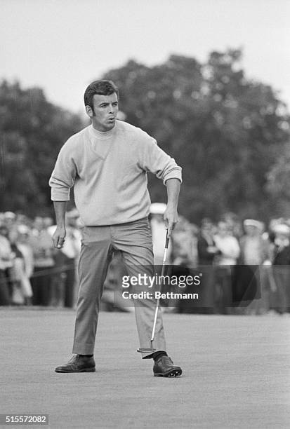 Tony Jacklin, the British Open Champion, starts to celebrate after dropping a putt on the 18th green for a par four on the hole. Jacklin proved that...