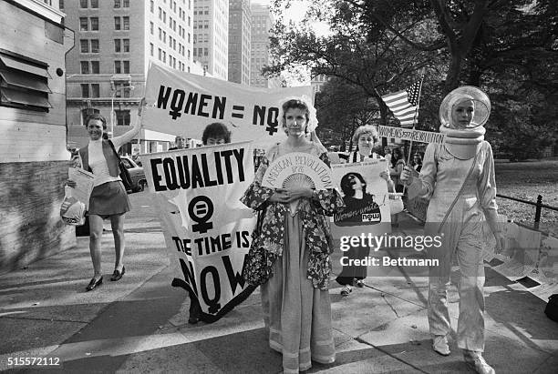 Chanting "We want 51 percent of everything," women liberationists march around City Hall and down Wall Street here, August 26, in celebration of the...