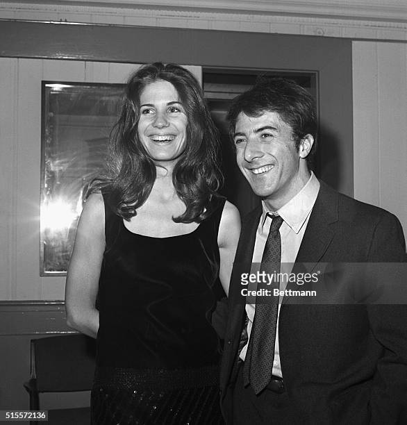 New York: Actor Dustin Hoffman and his girl friend, Ann Byrne, smiles for photographers during party at Sardi's here late Dec. 5th following the...