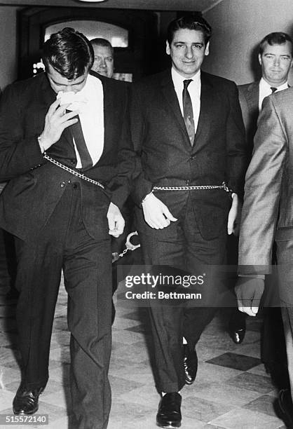Self-confessed Boston Strangler Albert DeSalvo is shown shackled to unidentified prisoner as he enters court house . Superior Court Judge Amadeo...