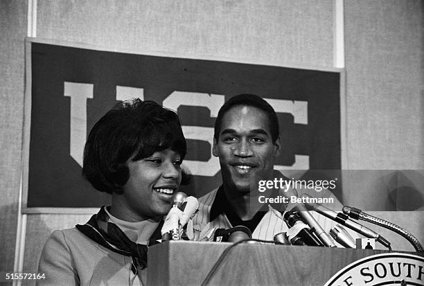 Los Angeles: USC halfback O.J. Simpson and his wife, Margaret, smile happily at a press conference 11/26 after he was named winer of the 1968 Heisman...